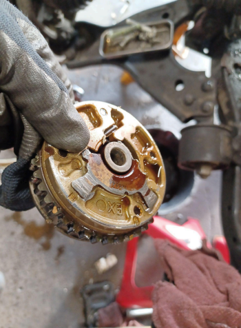 Close-up of a removed timing system component from a Chevrolet Equinox being
repaired.
